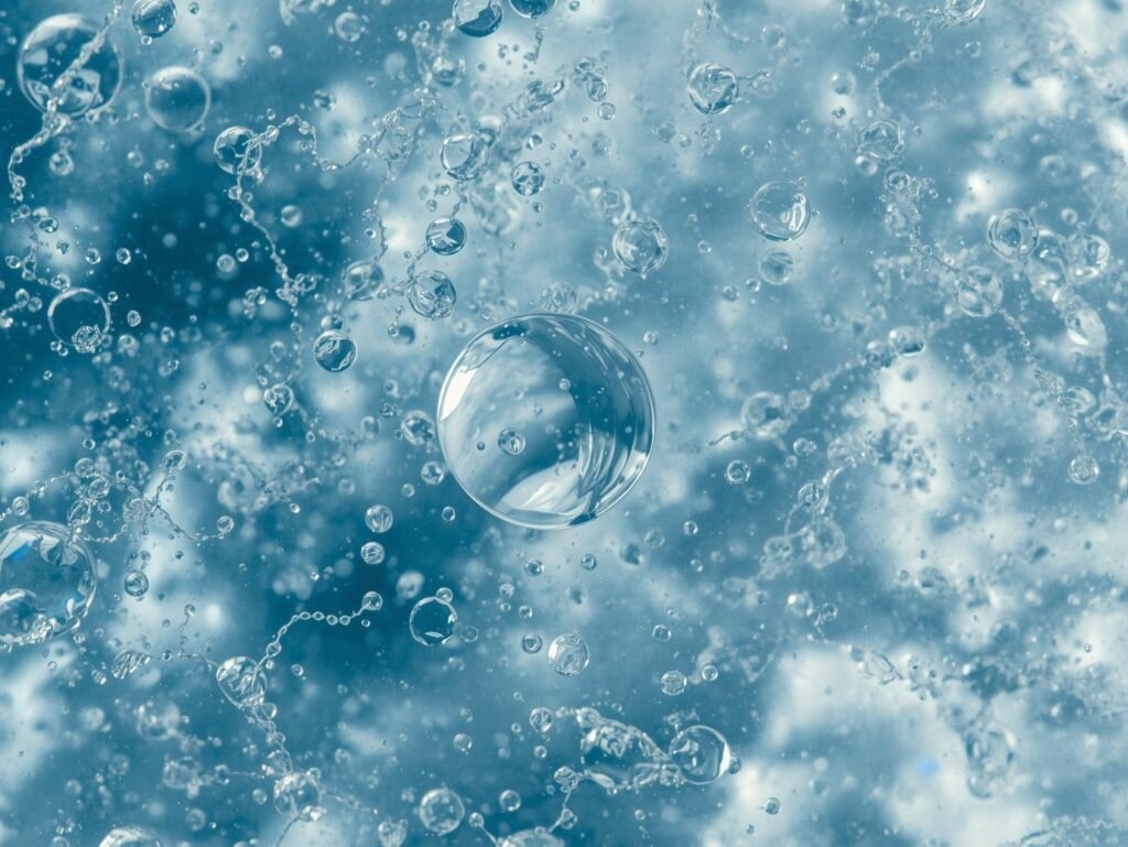 Cool blue image of water droplets and peptide strands evoking hydration and firmness.